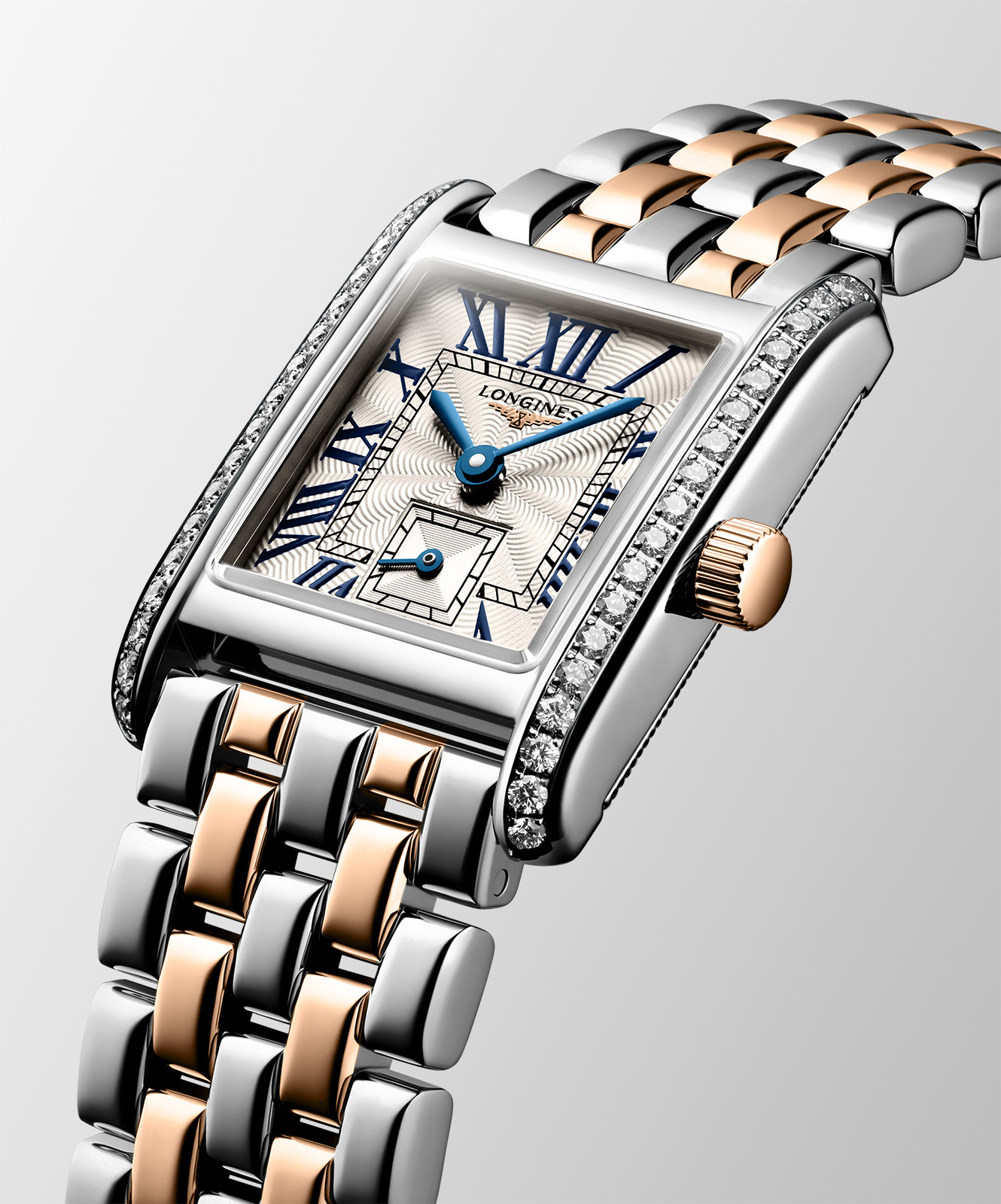TTPM97_The Mini DolceVita in steel and 18-carat rose gold is also available with brilliant-cut diamonds