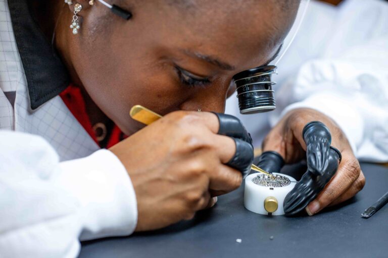 A watchmaker carefully assembles one of Franck Muller’s movements