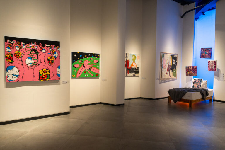 A selection of colourful contemporary artworks from Repetisi Memori and Lucid Dreams displayed across the walls of Labyrinth Art Gallery, creating a lively dialogue between surreal figures, bold colours, and graphic compositions.
