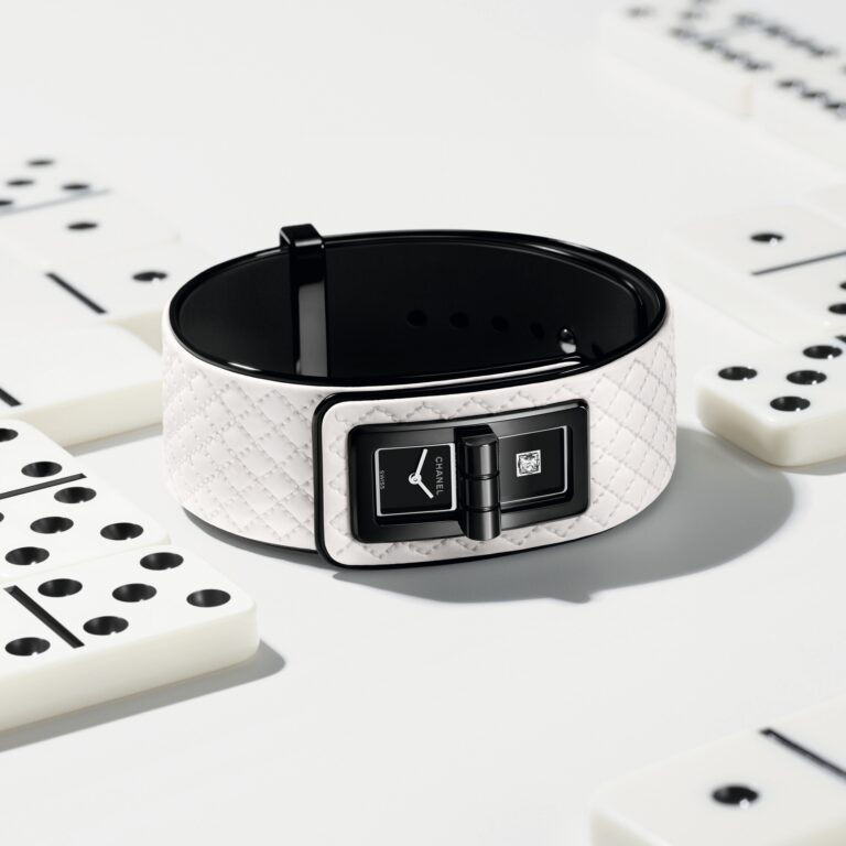 The Code Coco Game combines a black-coated steel case with a white quilted calfskin leather strap