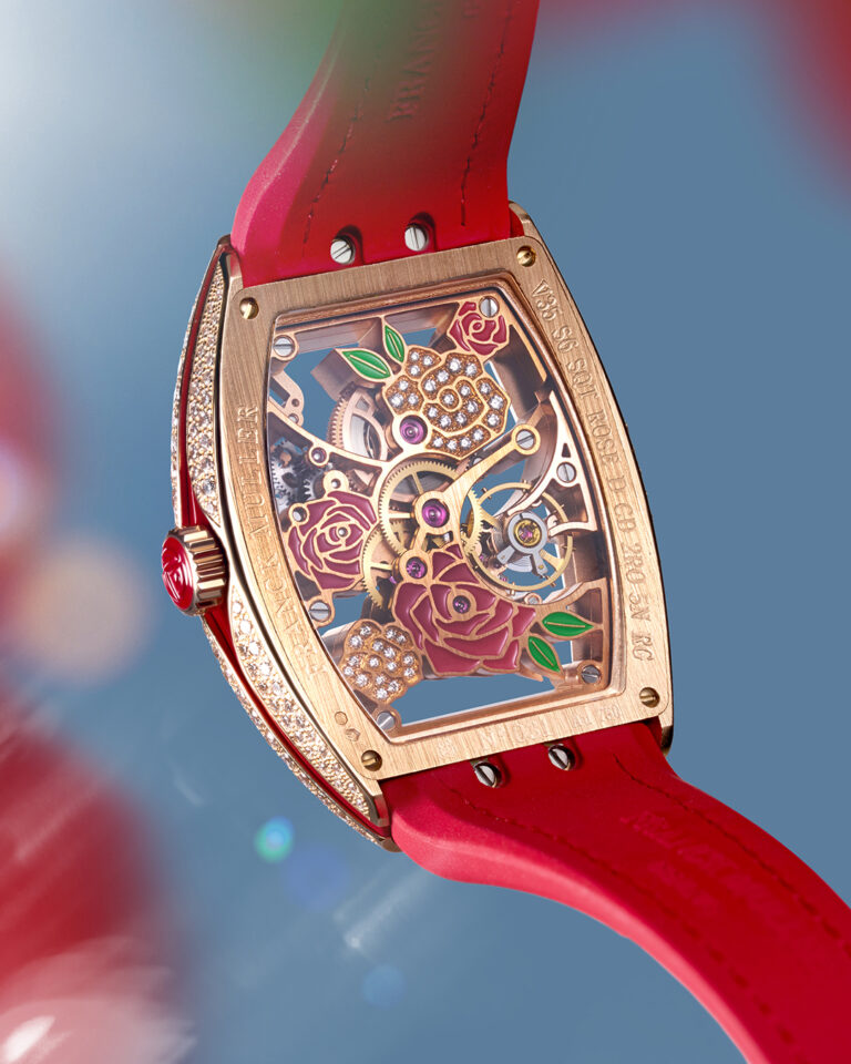 The floral motif extends to the back of the watch as seen through the case back